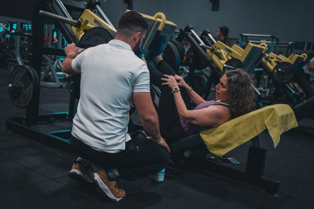 Gym coach welcoming a new member