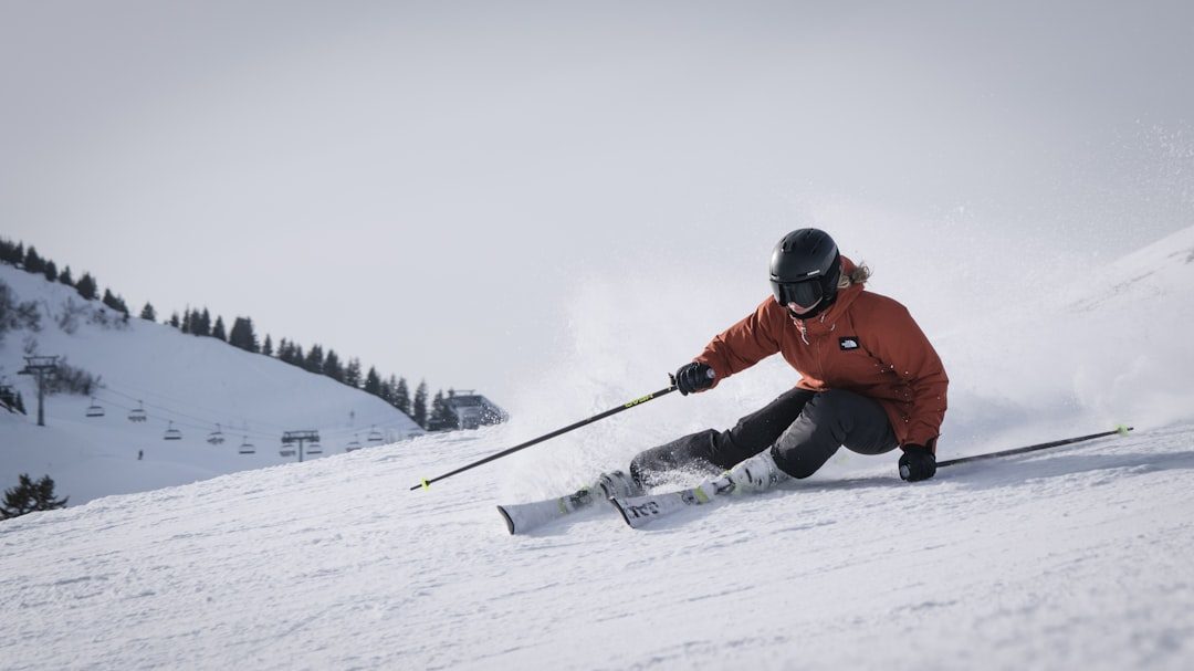 Family ski lesson progressing on a wide groomed slope