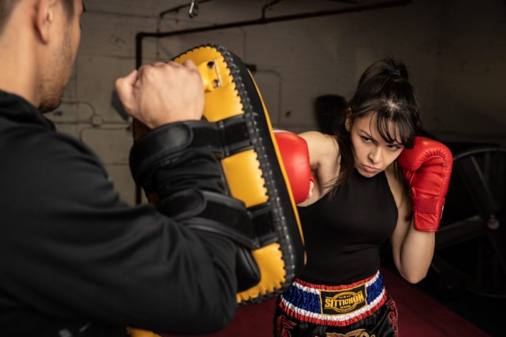 Boxer completing a conditioning round on a heavy bag