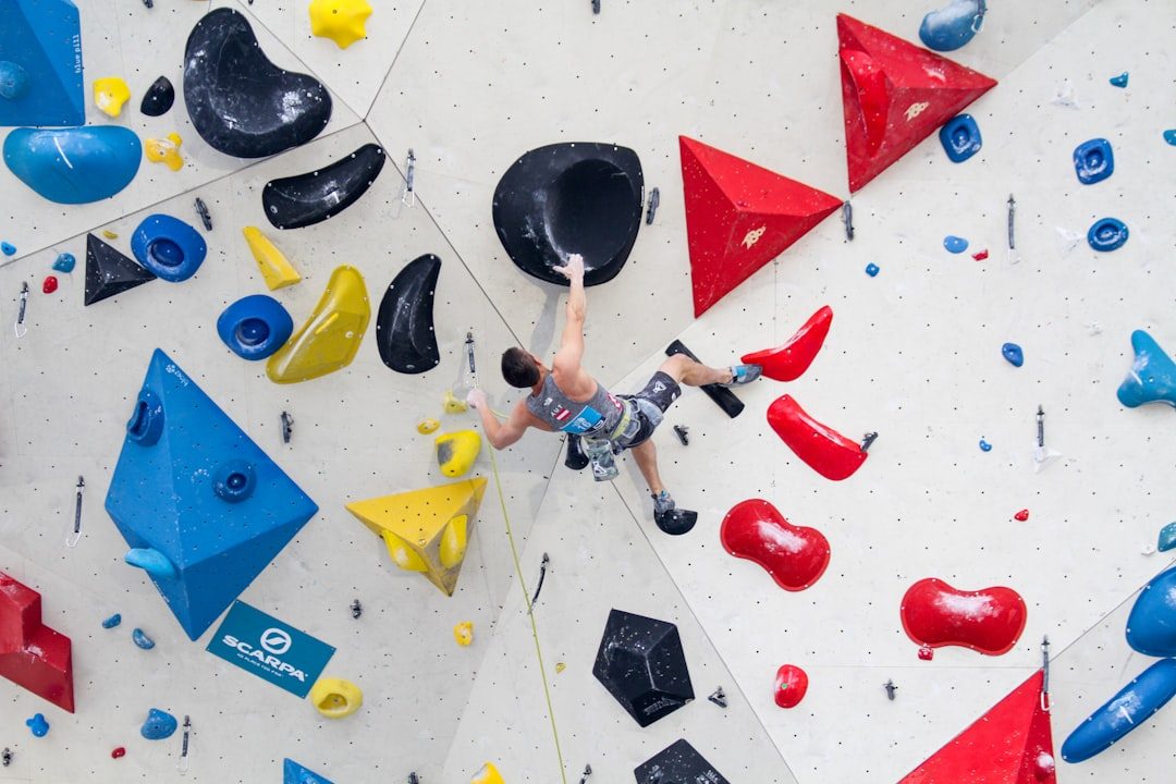 Climber studying holds before starting a route
