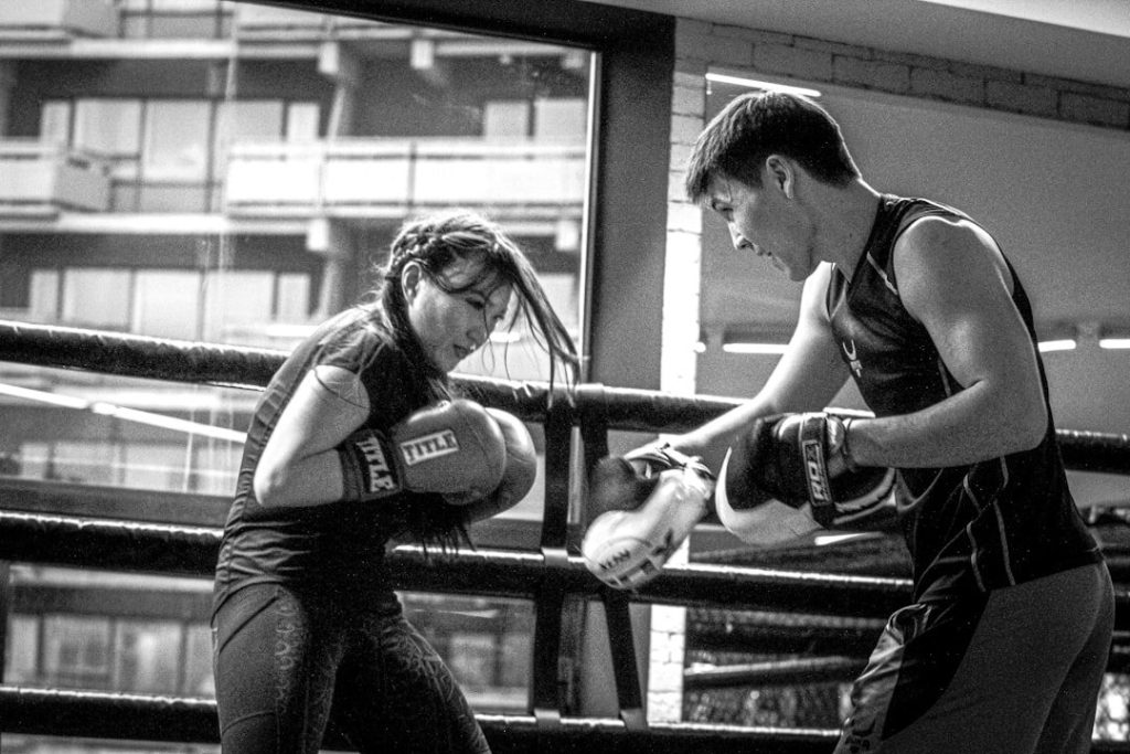 Boxing coach demonstrating guard and distance