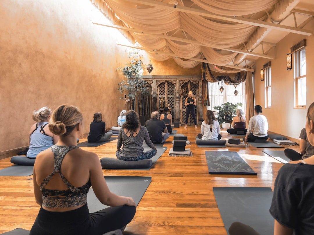 Yoga practitioner moving through a calm studio practice