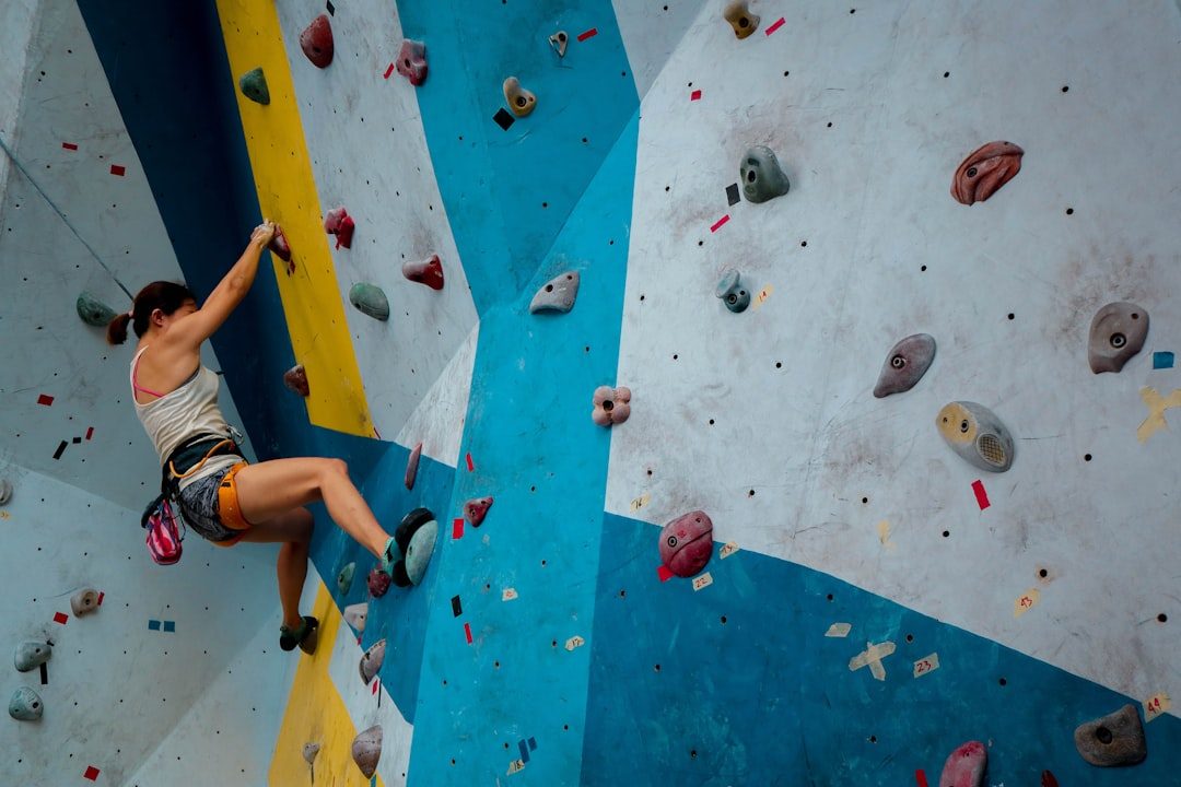 Climber training during a coached indoor session
