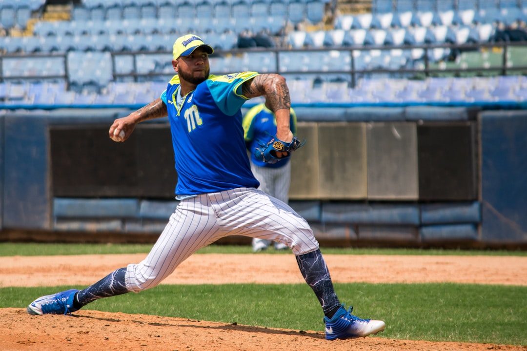Young baseball pitcher working on safe delivery mechanics