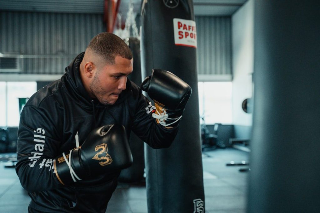 Boxing conditioning coach beside the ring