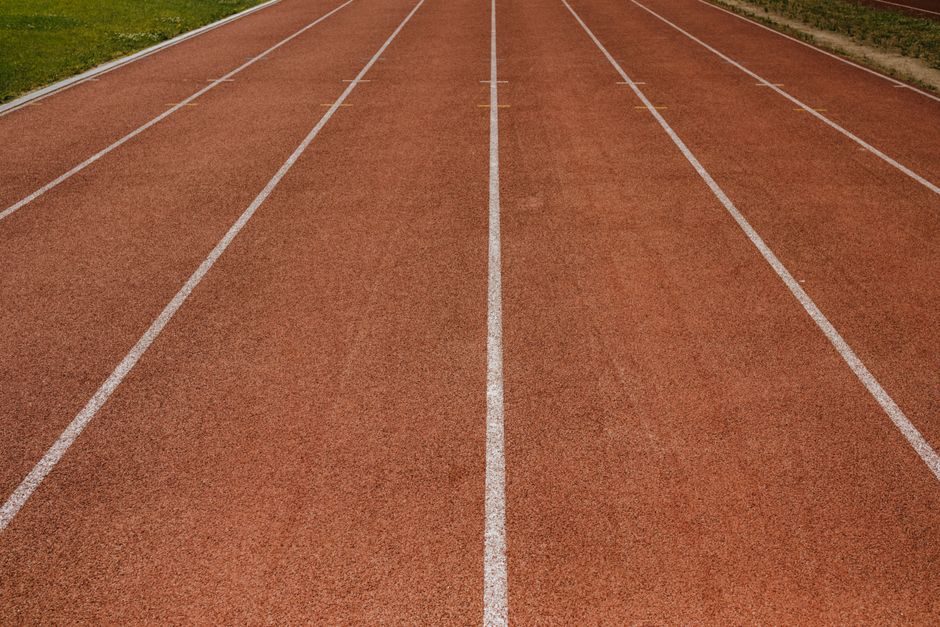 Runner completing interval training on a track