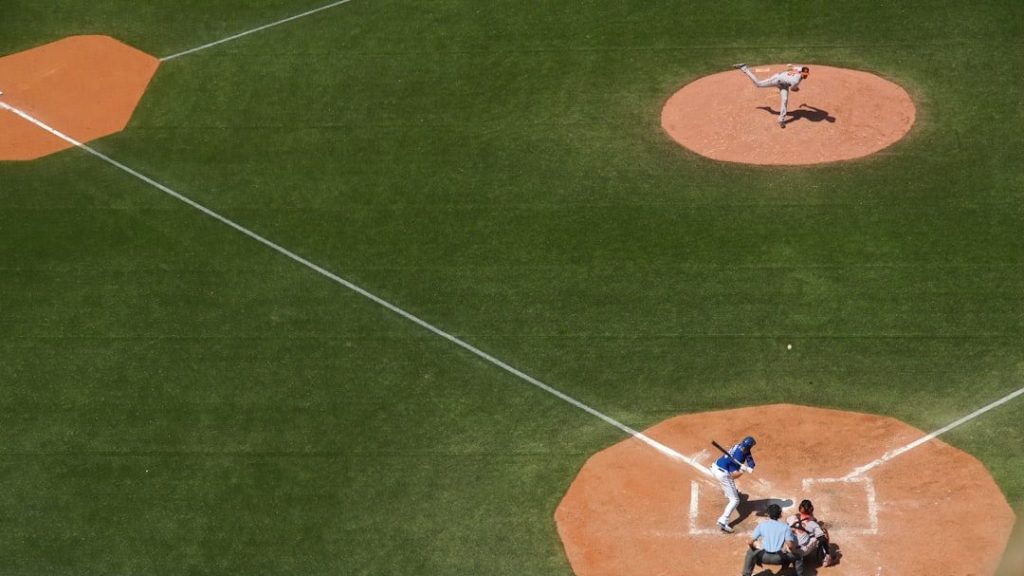 Competitive baseball training session inside a performance facility