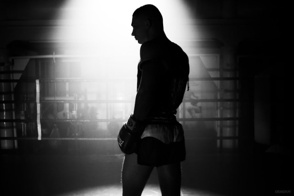 Private boxing coach working one to one in the ring