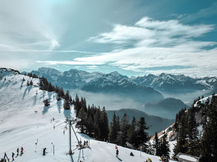 Skier practising carved turns on a groomed slope