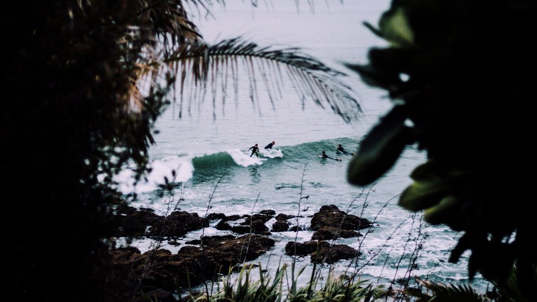 Surfer riding a wave during an ocean coaching session
