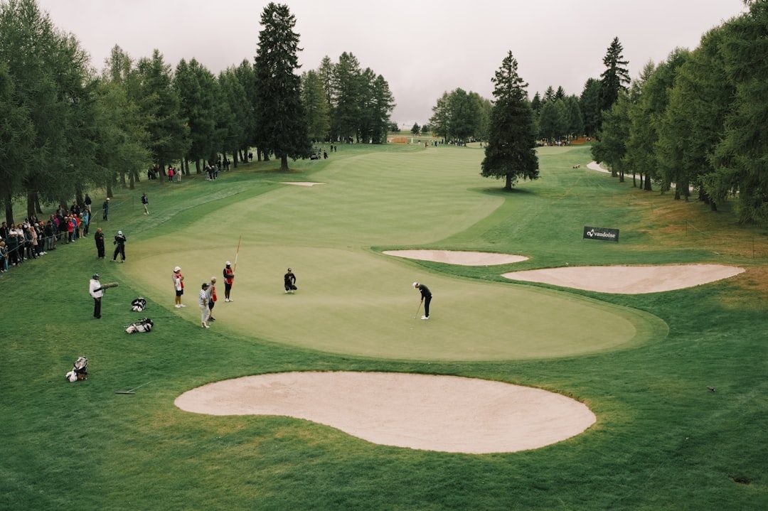 Golfer practising a controlled swing on the course