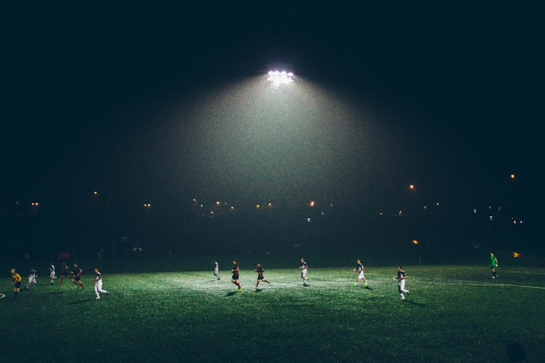 Soccer players training together on the pitch