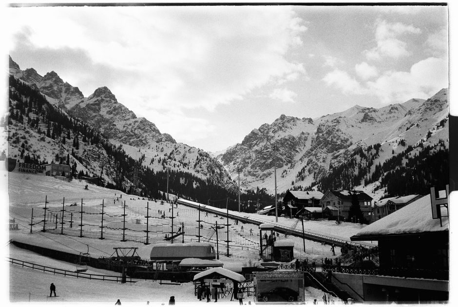 Skiers assessing mountain terrain and conditions