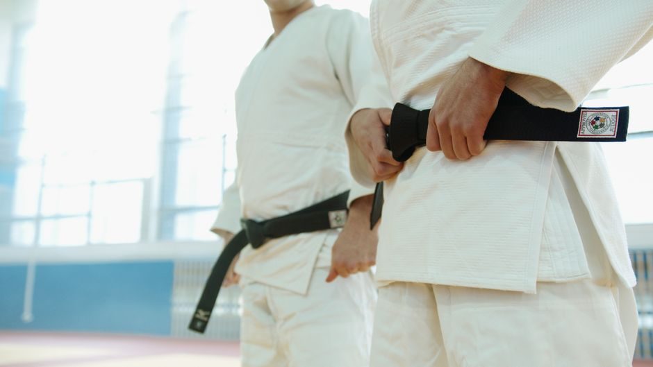 Martial arts coach demonstrating technical movement