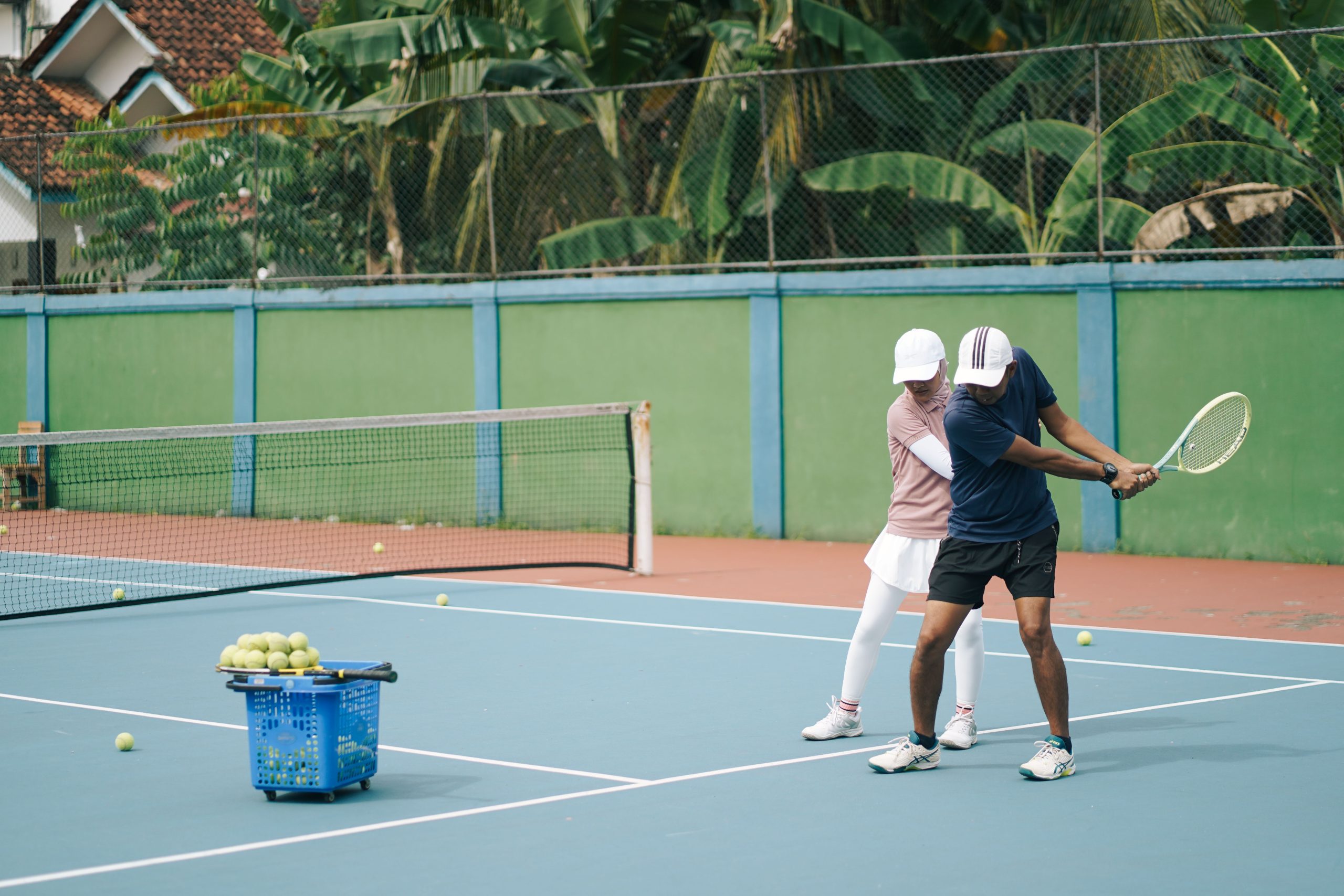 Padel coach guiding a player during a training session
