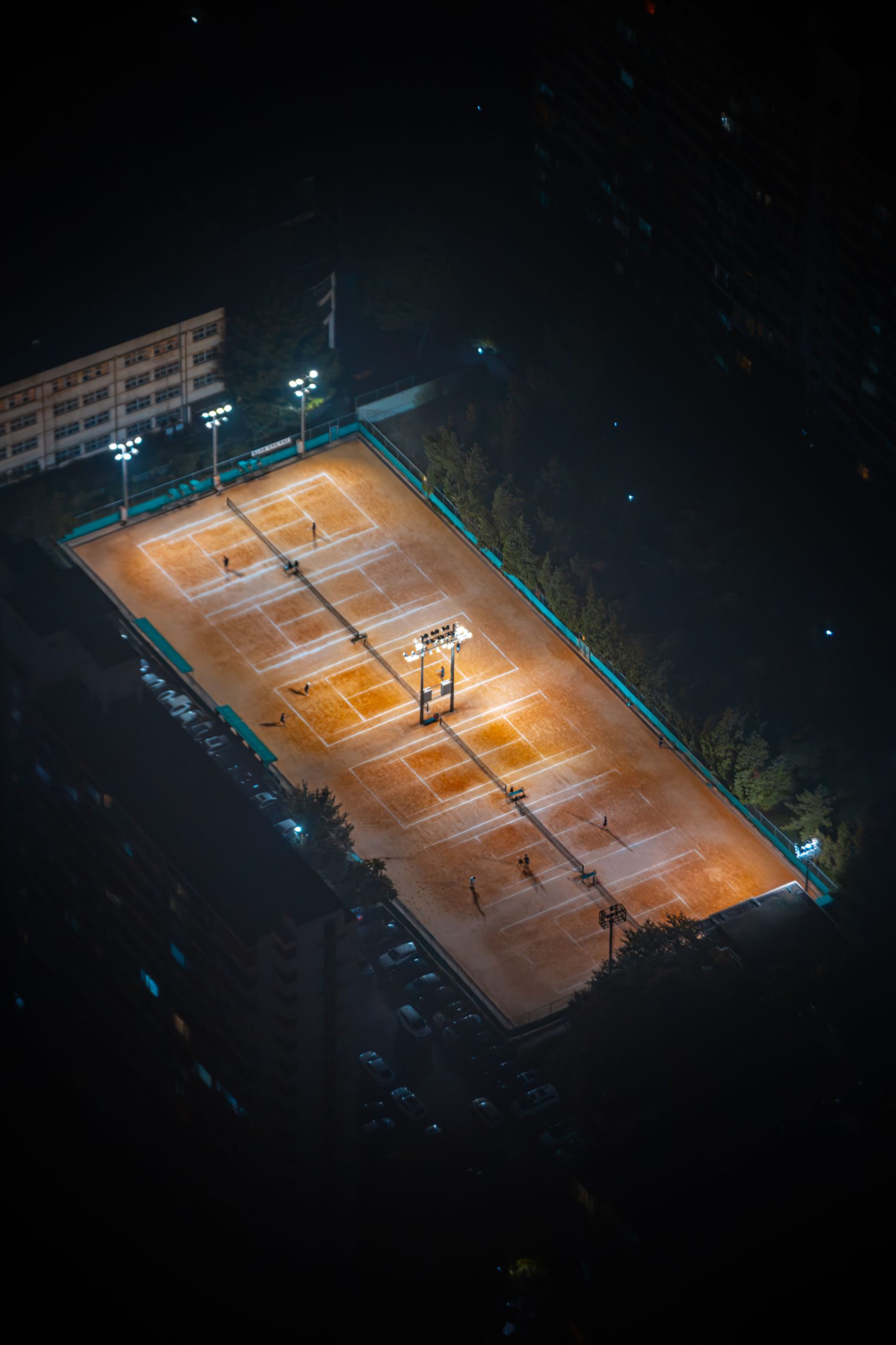 Floodlit tennis courts ready for evening club play