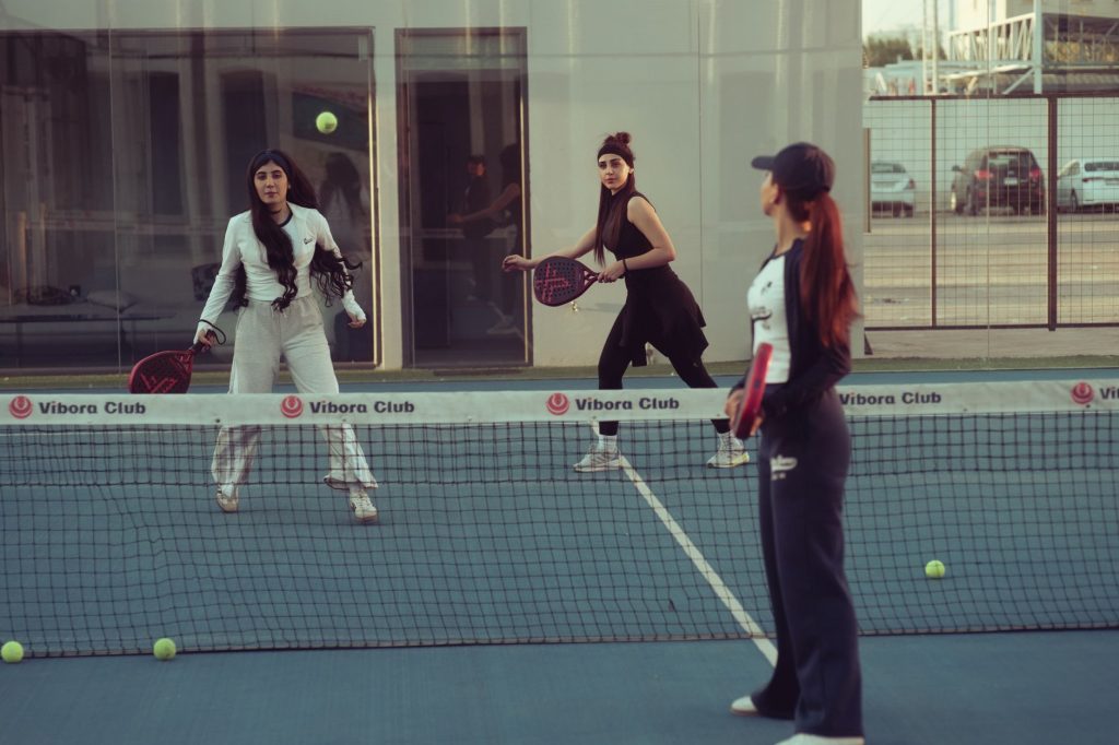 Outdoor group challenge session on a sports court