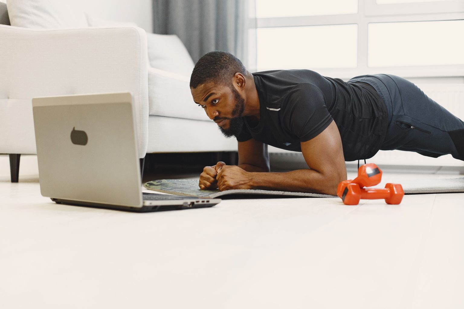 Athlete using professional strength training equipment in a gym