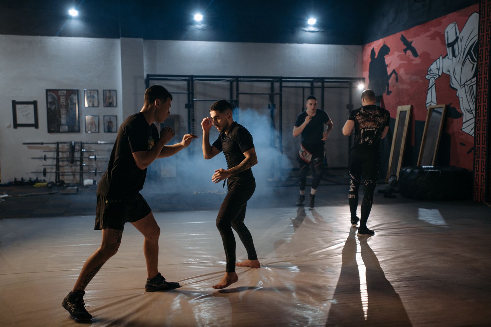 MMA fighters sparring in a training gym