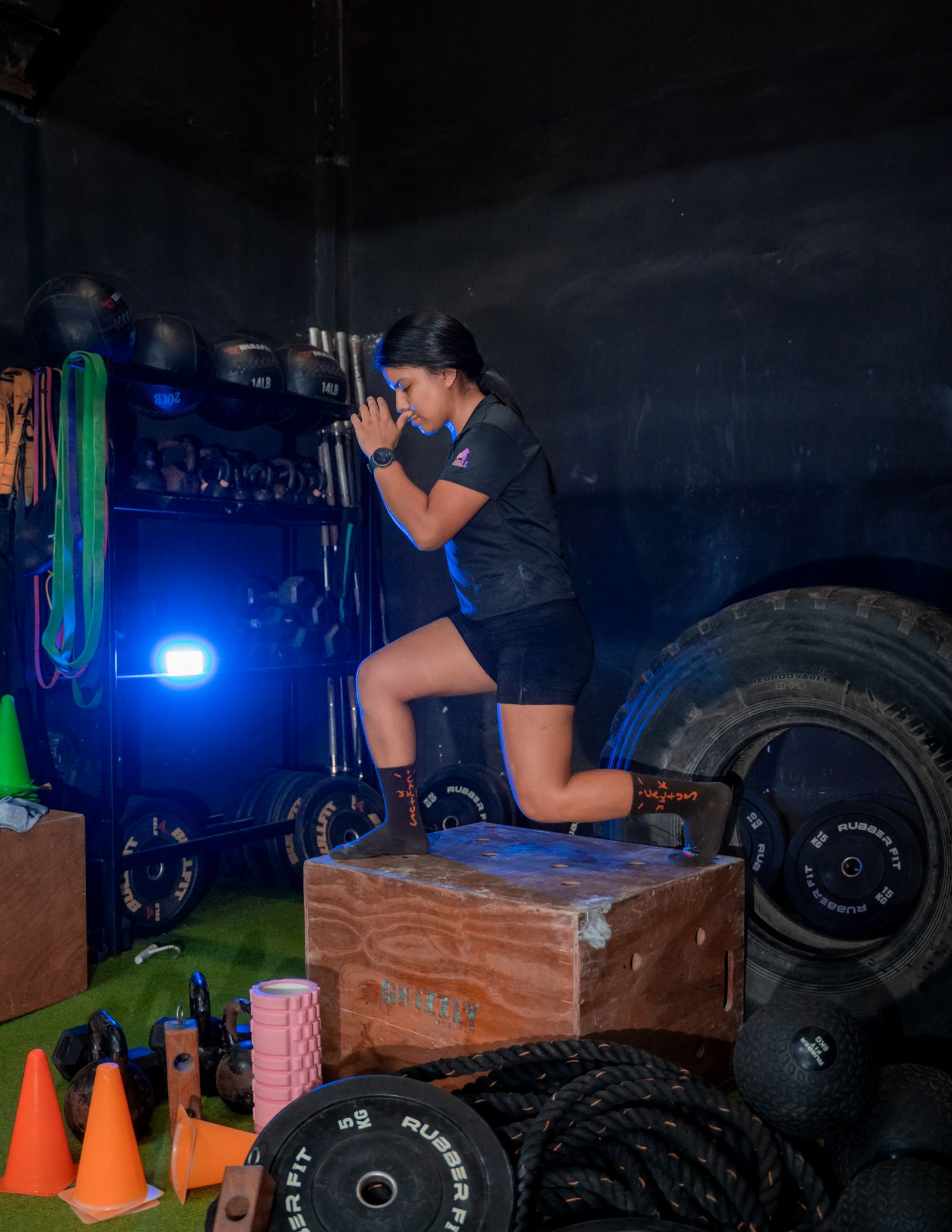 Woman completing strength and conditioning training
