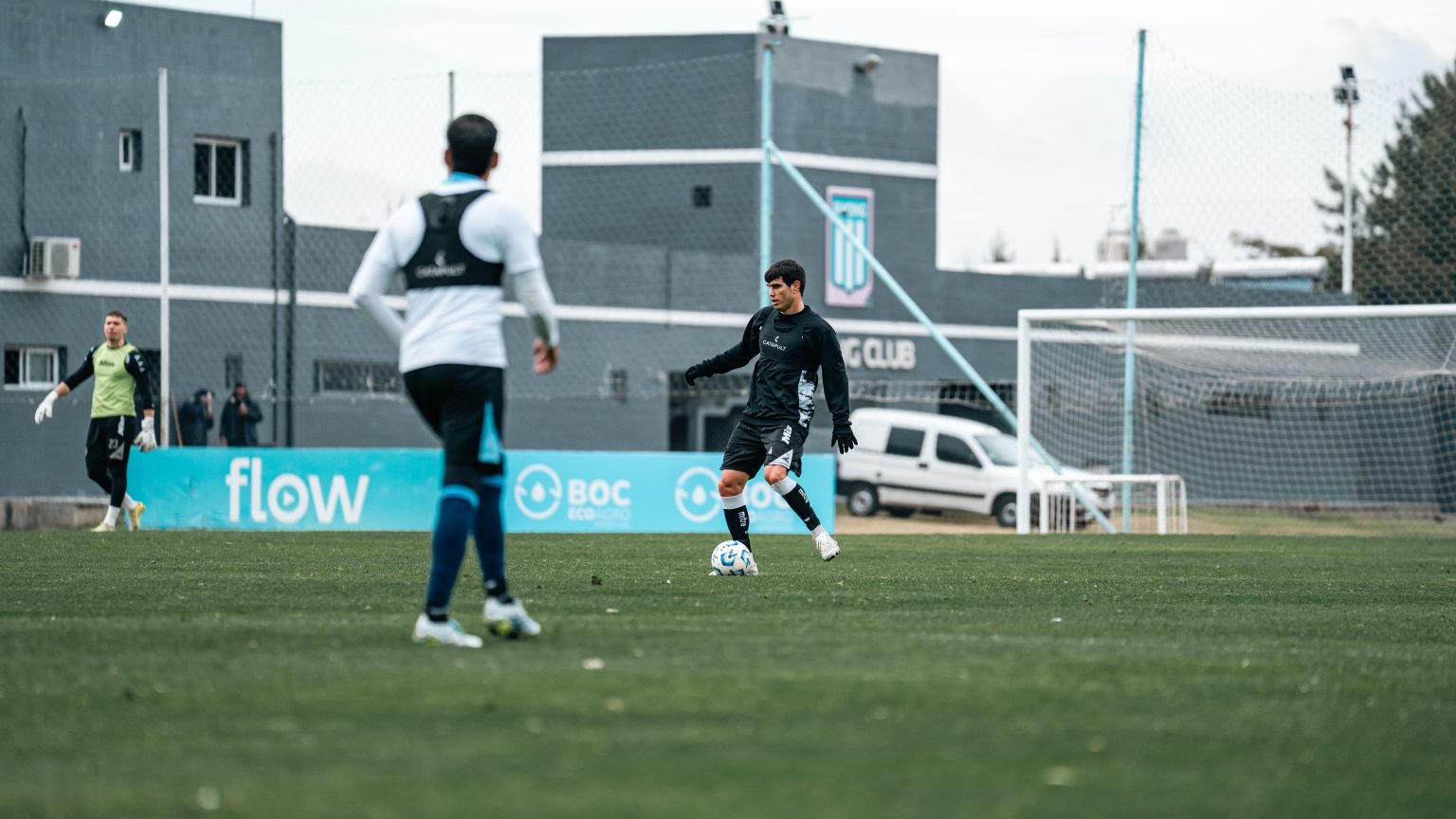 Football players training together on a grass field