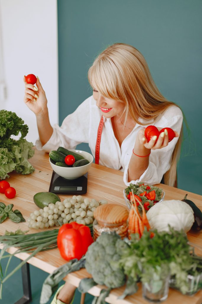 Dietitian working with fresh vegetables and healthy ingredients