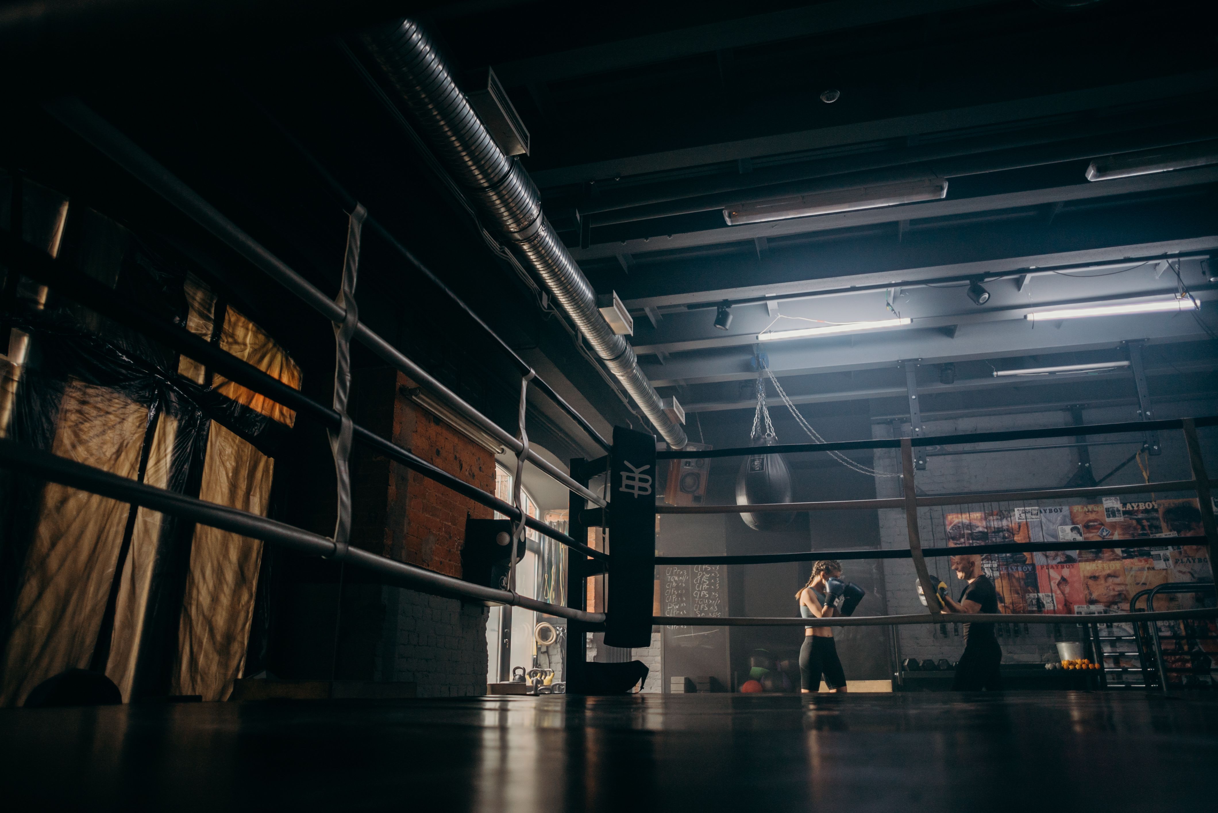 MMA sparring action in a combat sports gym