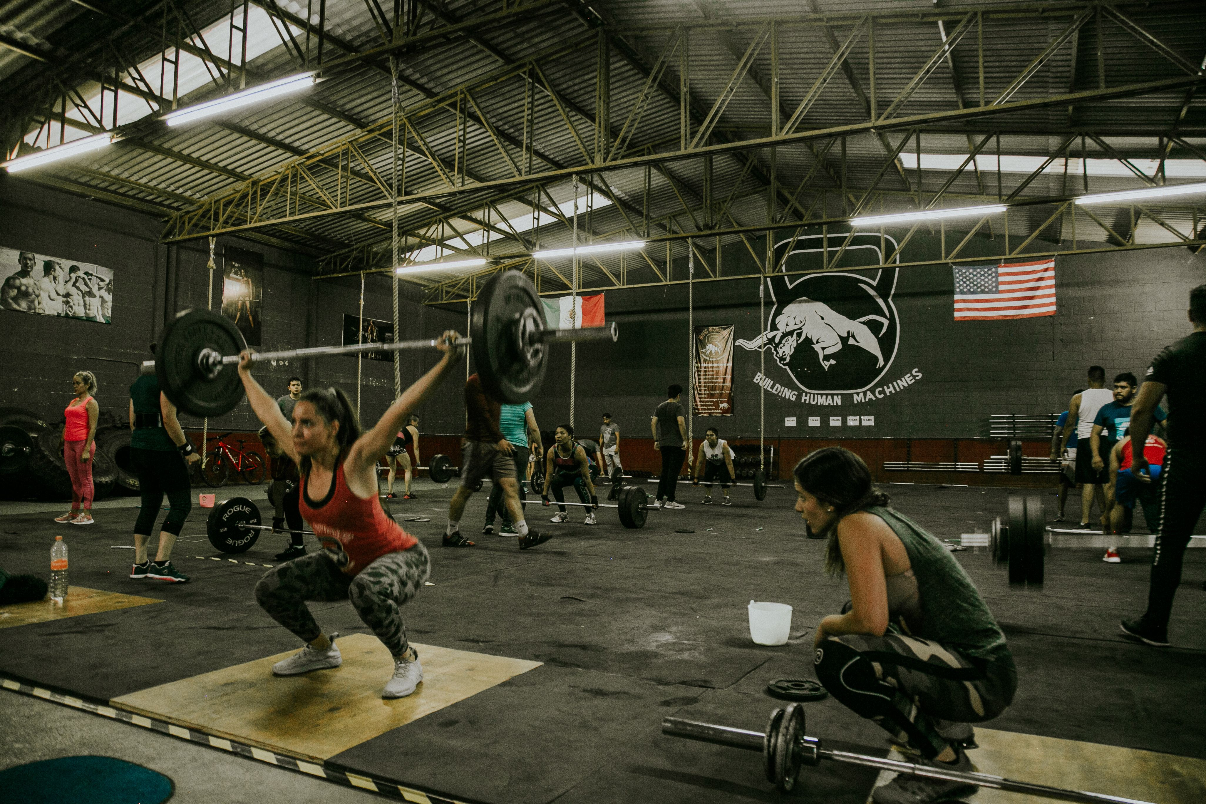Athlete using professional strength training equipment in a gym