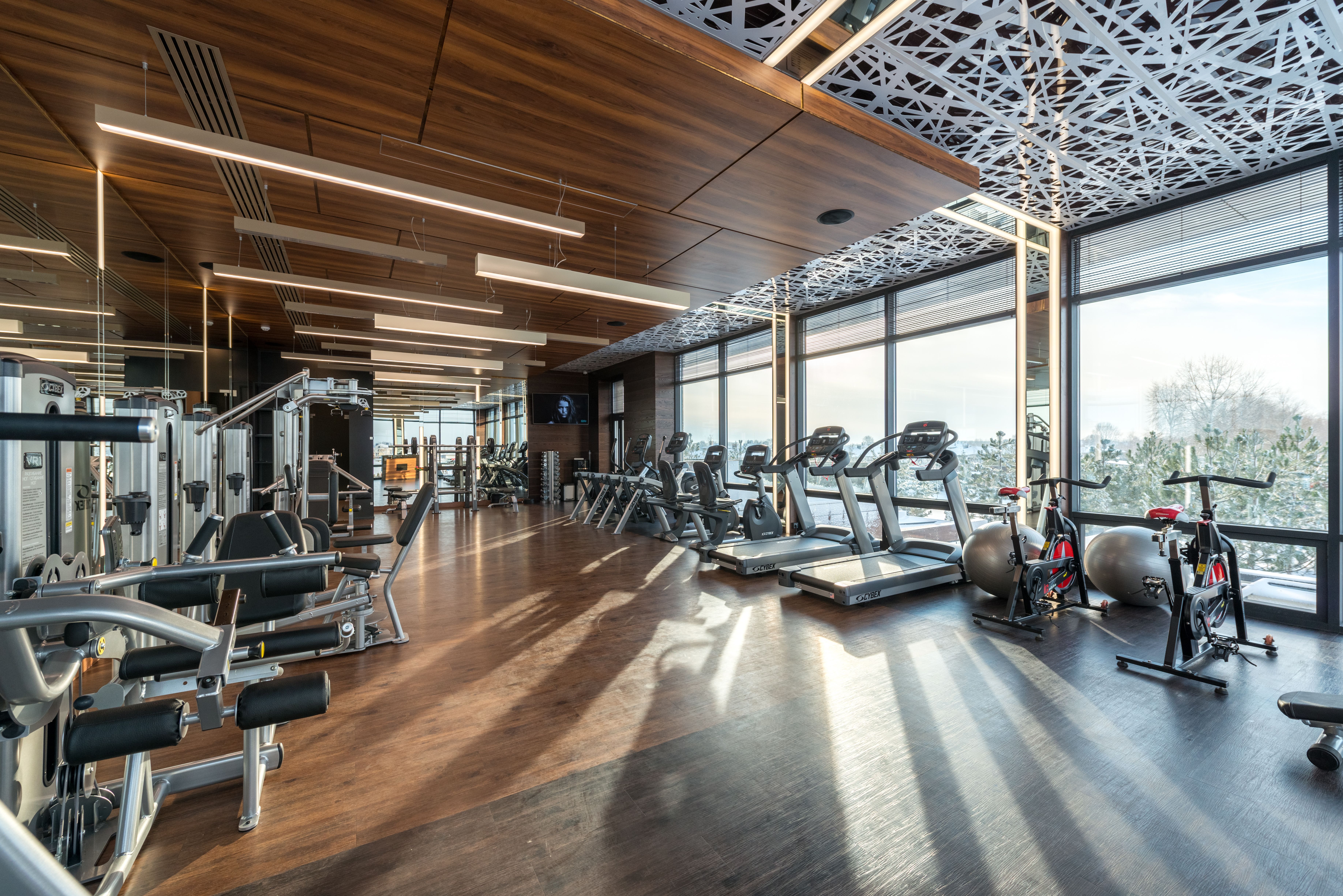 Personal trainer coaching a client during a gym session