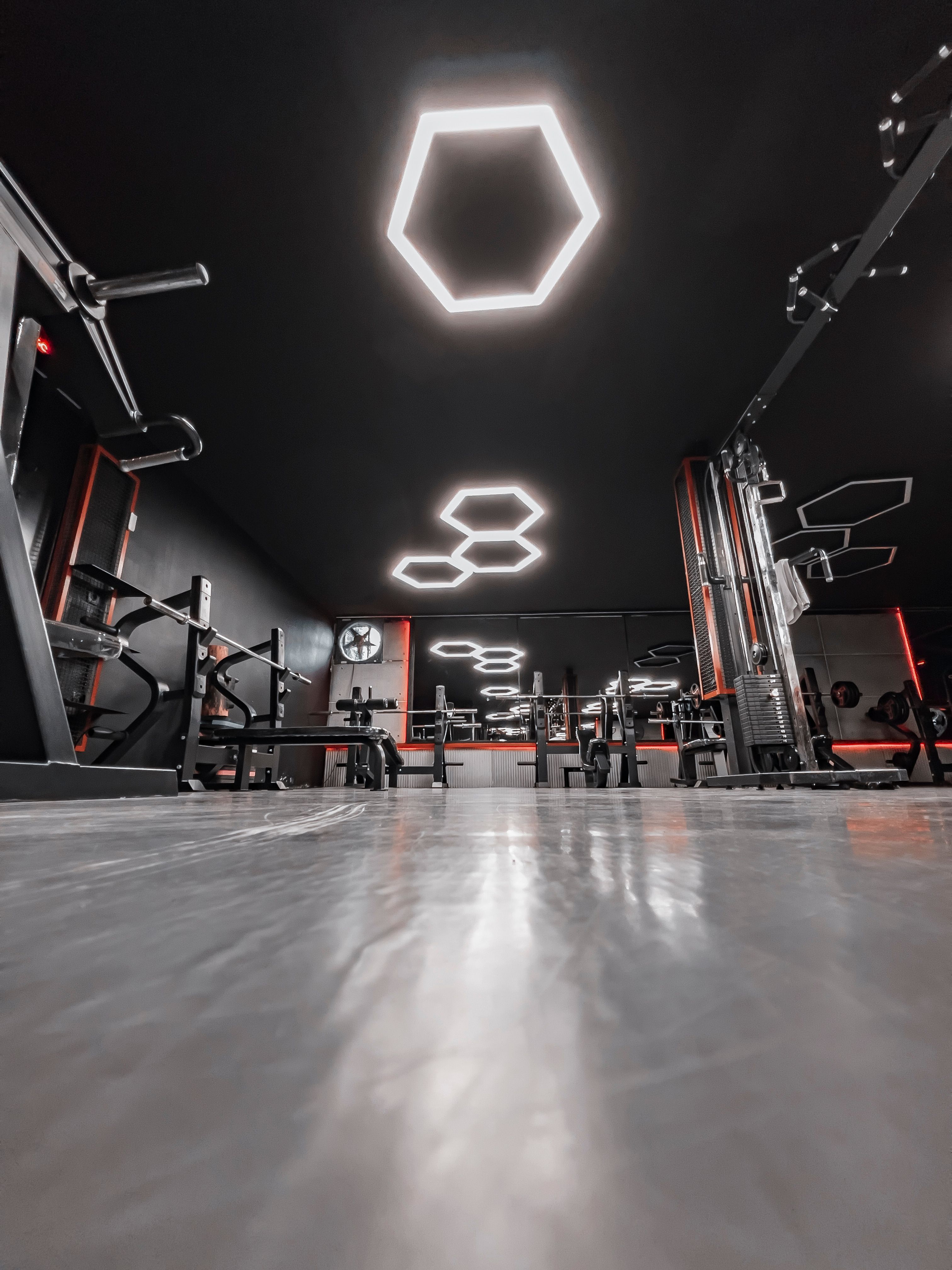 Bright modern gym interior with strength and cardio equipment