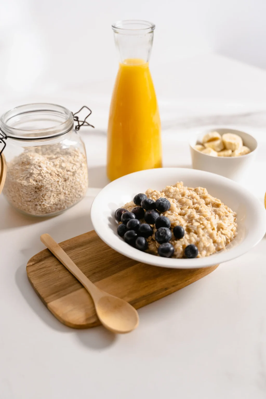 Healthy breakfast with oatmeal blueberries and fresh juice