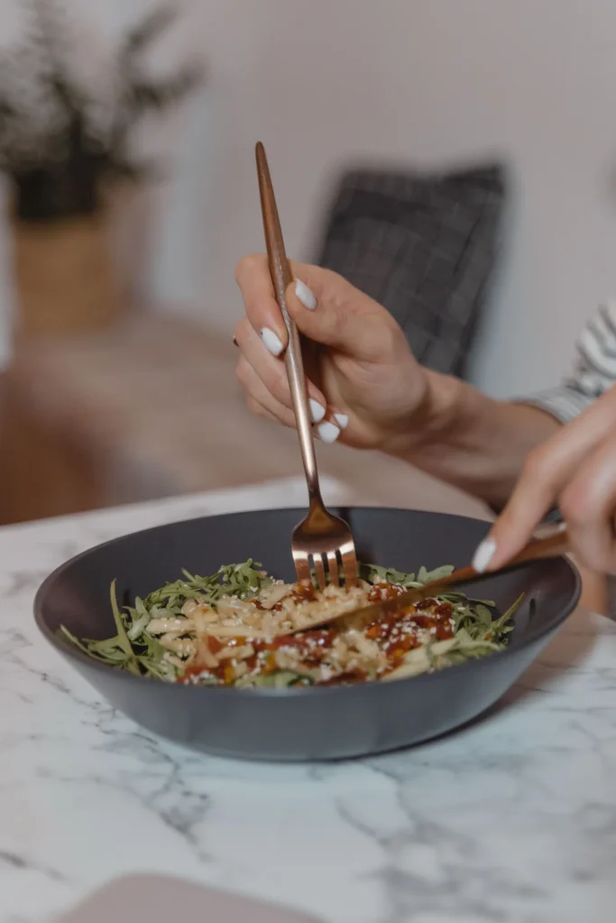 Nutritionist discussing healthy eating with a client in a kitchen