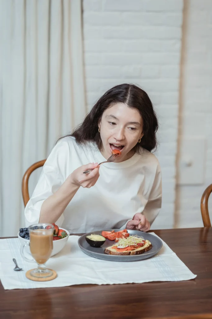 Woman preparing a healthy meal with fresh vegetables