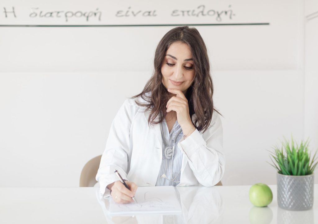 Dietitian preparing a weekly meal plan during a nutrition consultation