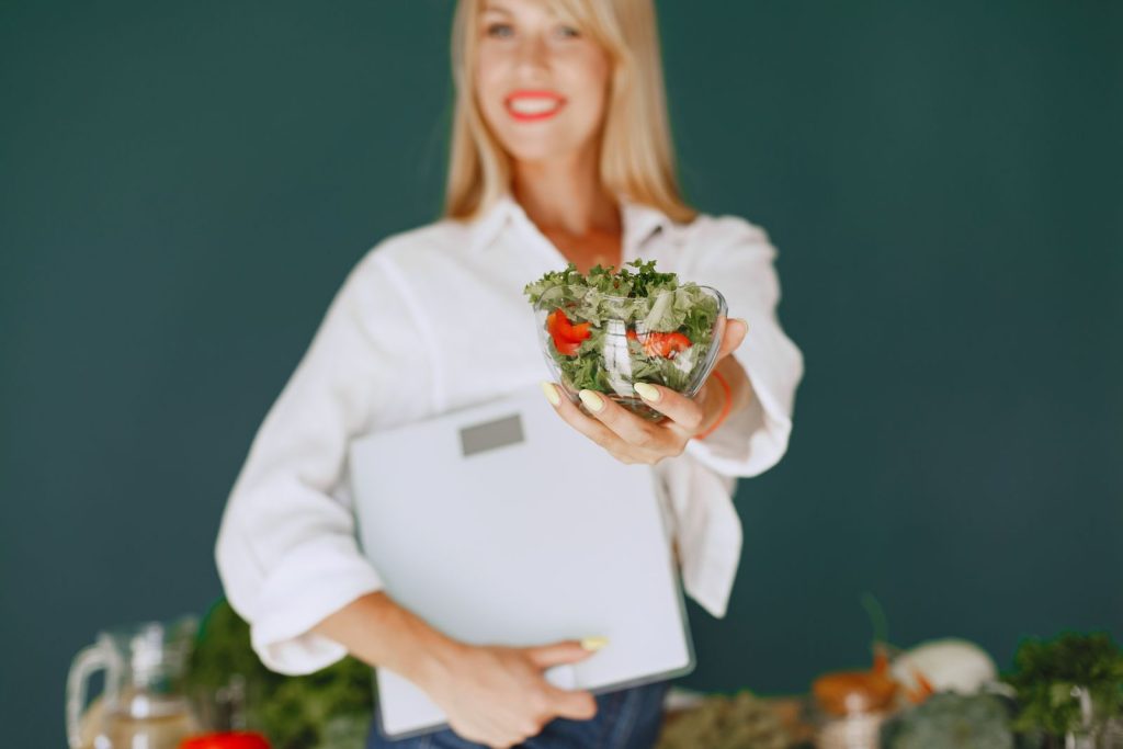Nutritionist discussing healthy eating with a client in a kitchen
