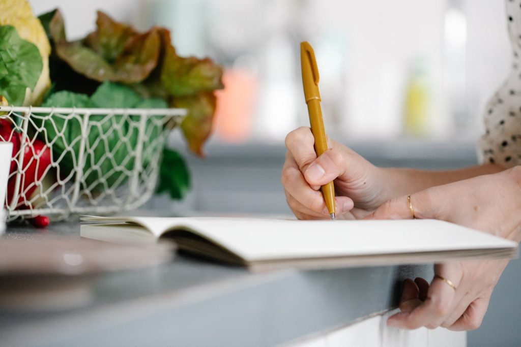 Nutrition coach explaining a food chart during a consultation