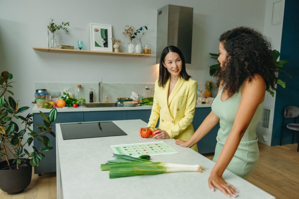Nutritionist holding broccoli in a professional consultation office