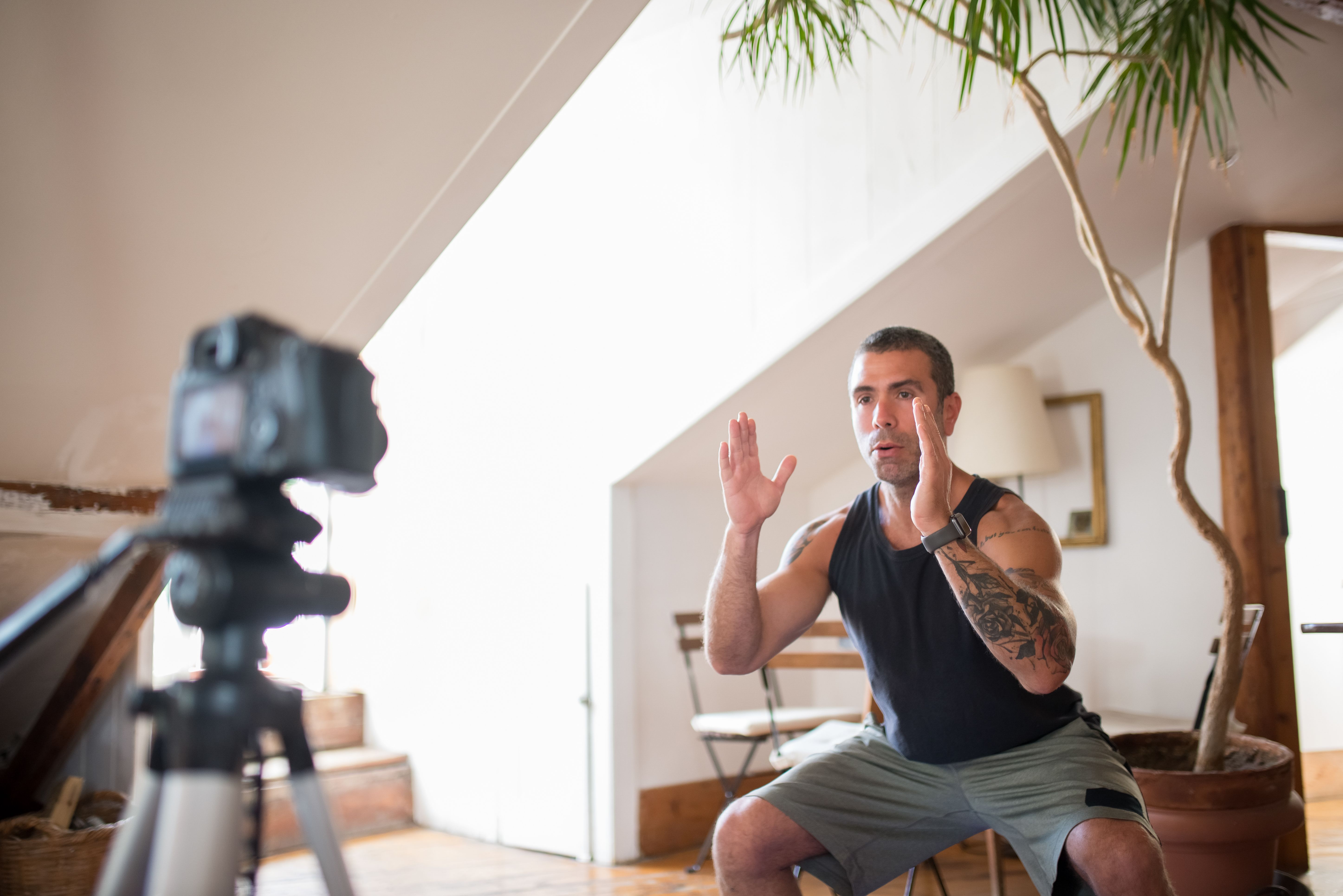 Online personal trainer coaching a client by video