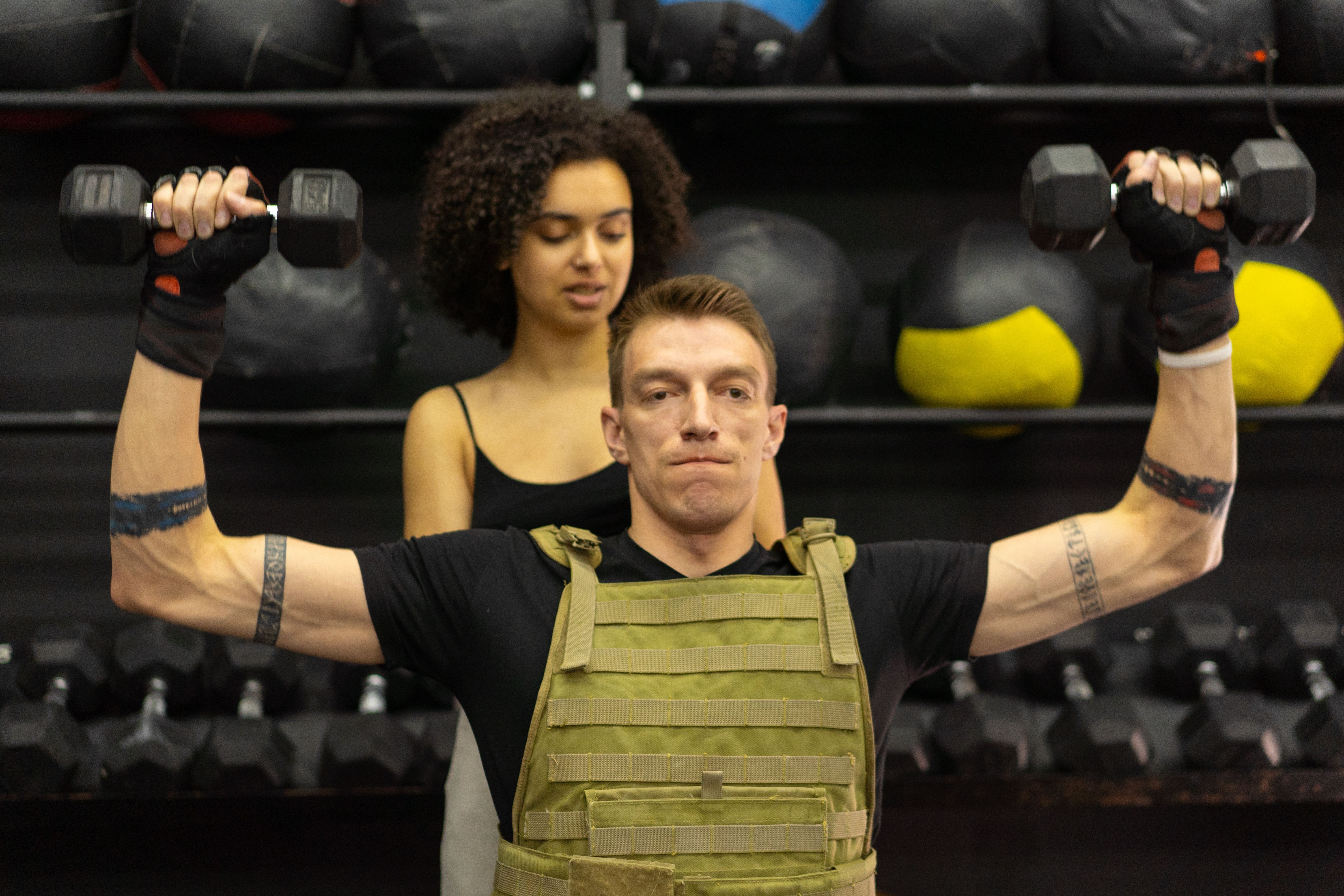 Personal trainer reviewing fitness notes and training ideas