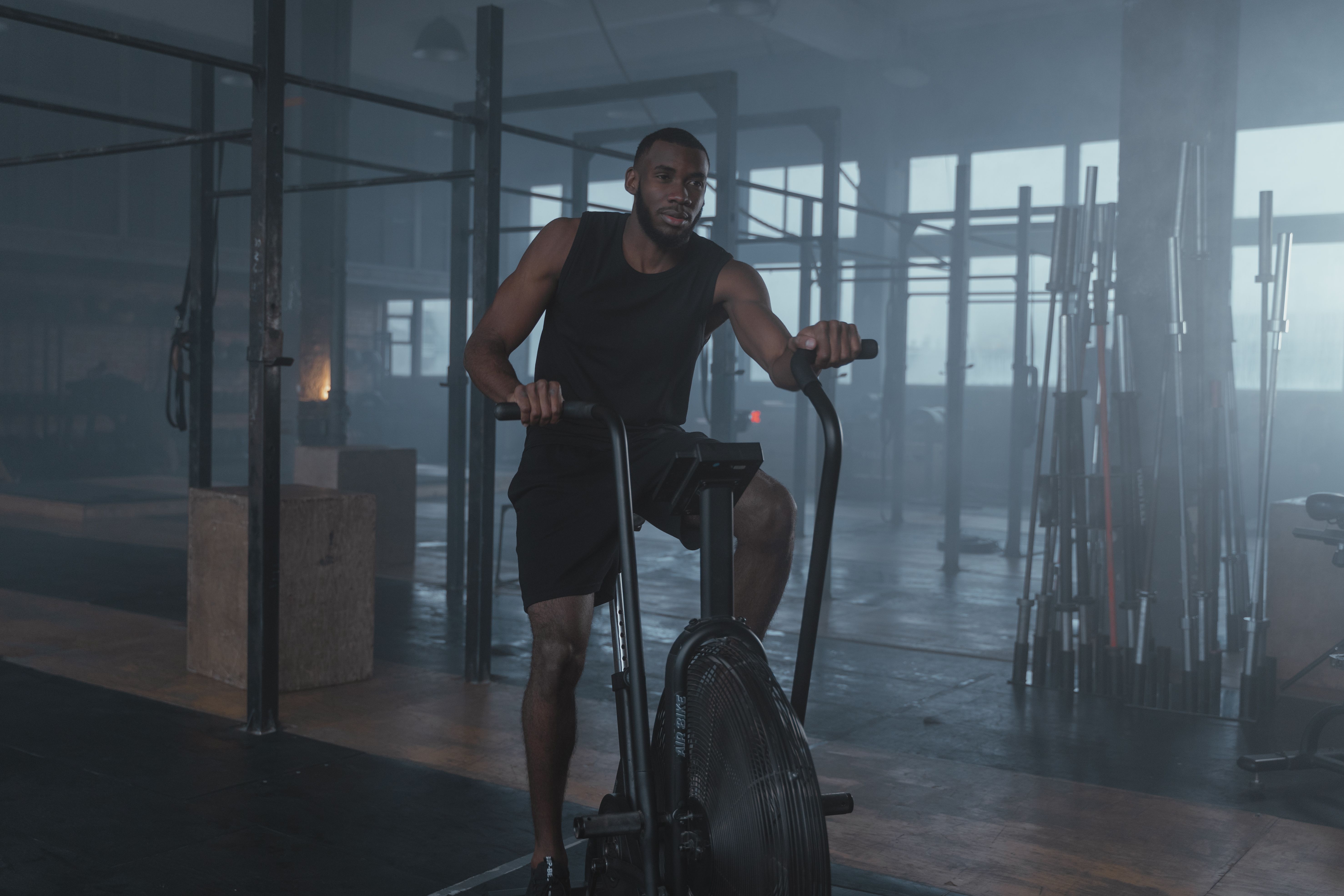 Personal trainer coaching an athlete through a gym workout