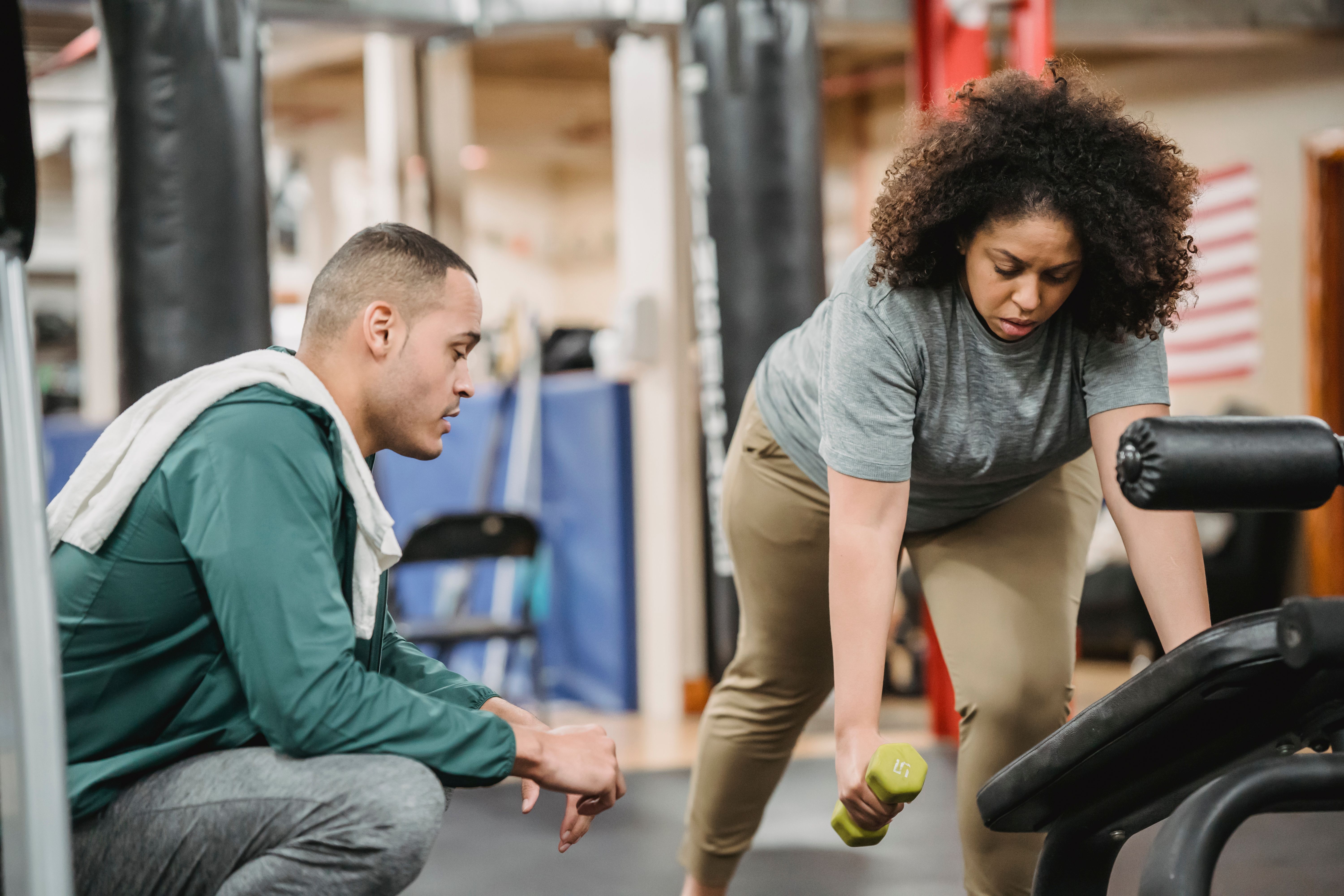 Personal trainer reviewing fitness notes and training ideas