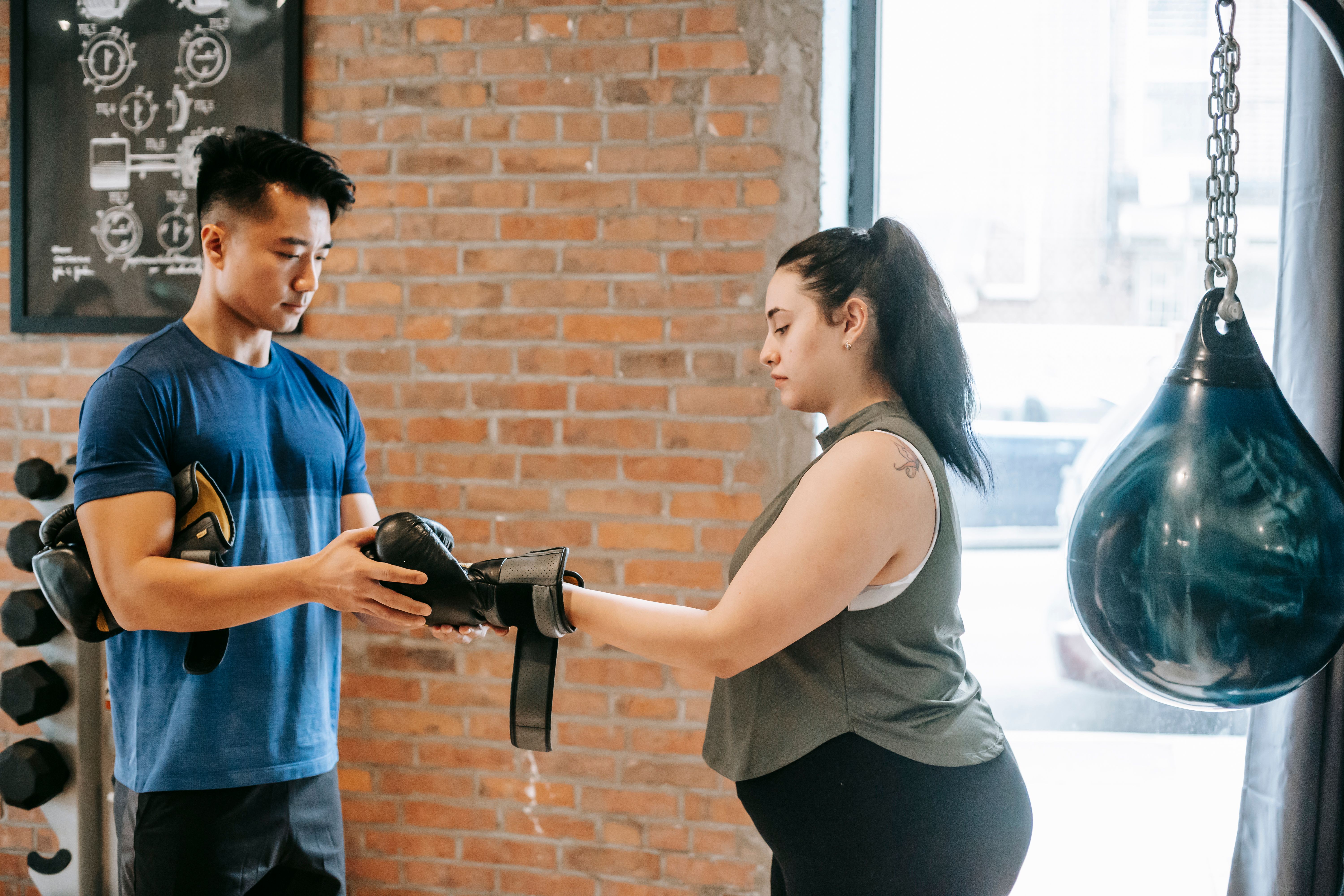 Personal trainer reviewing fitness notes and training ideas