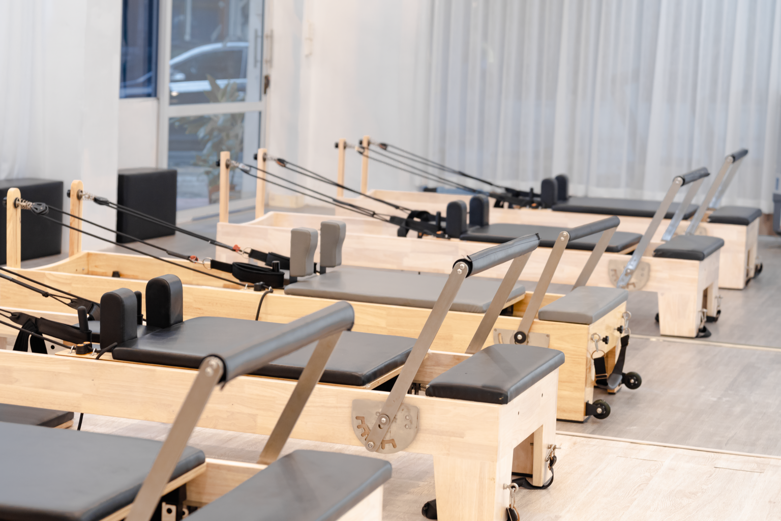 Pilates training inside a modern reformer studio