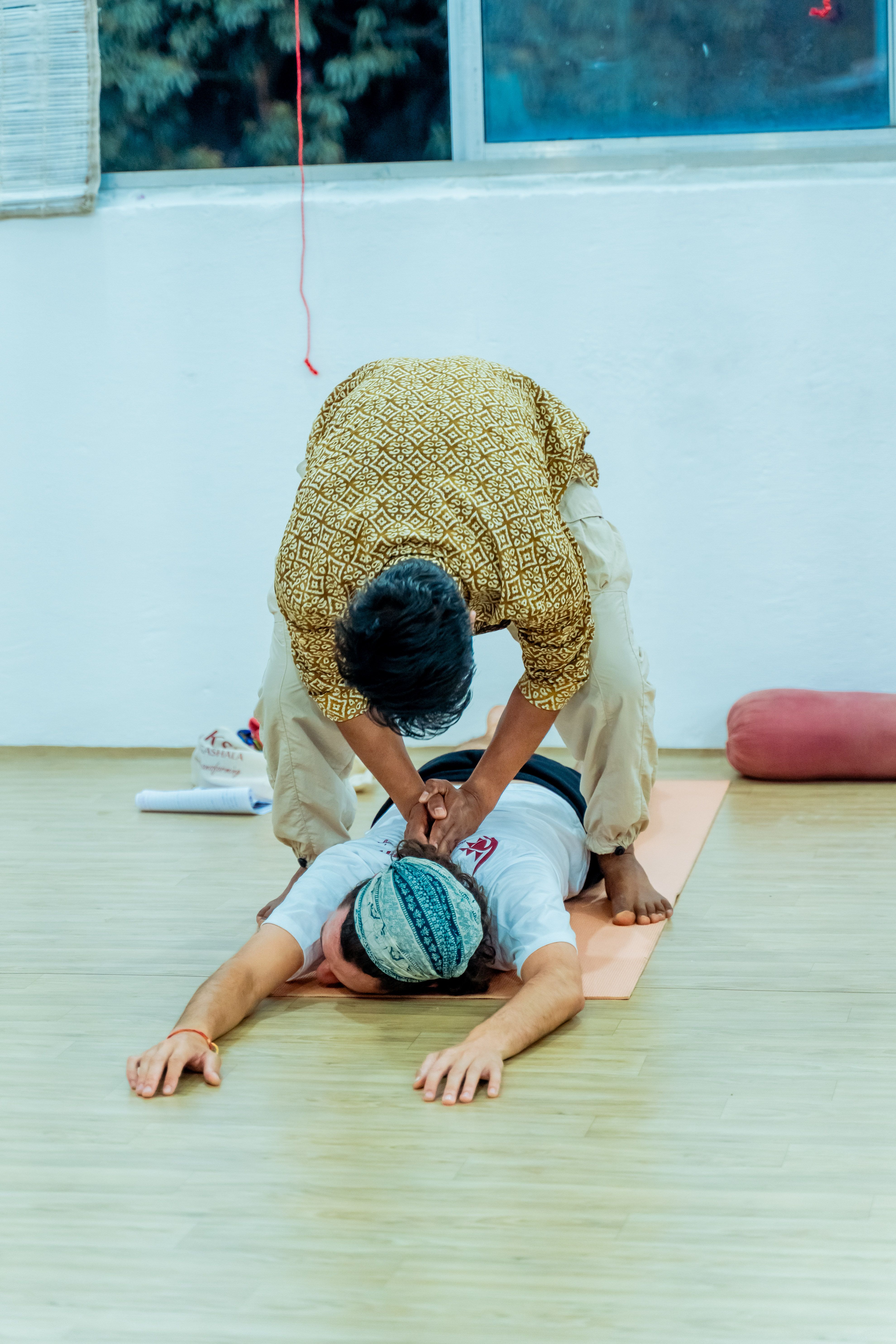 Diverse group participating in an indoor yoga workshop