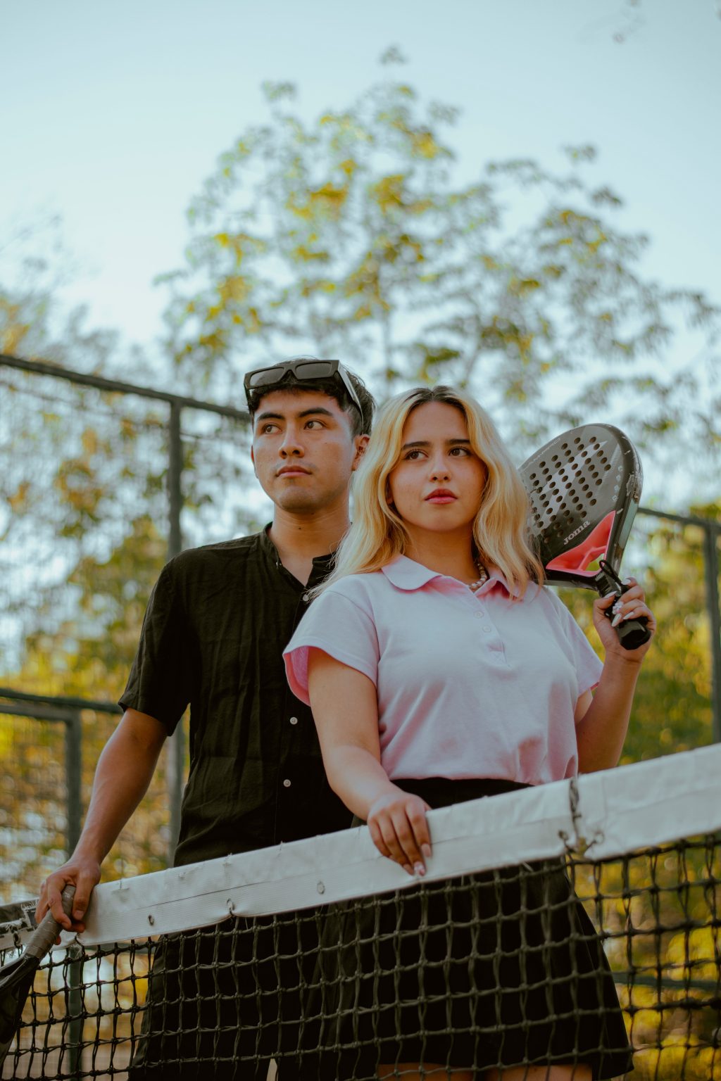 Paddle tennis players on court