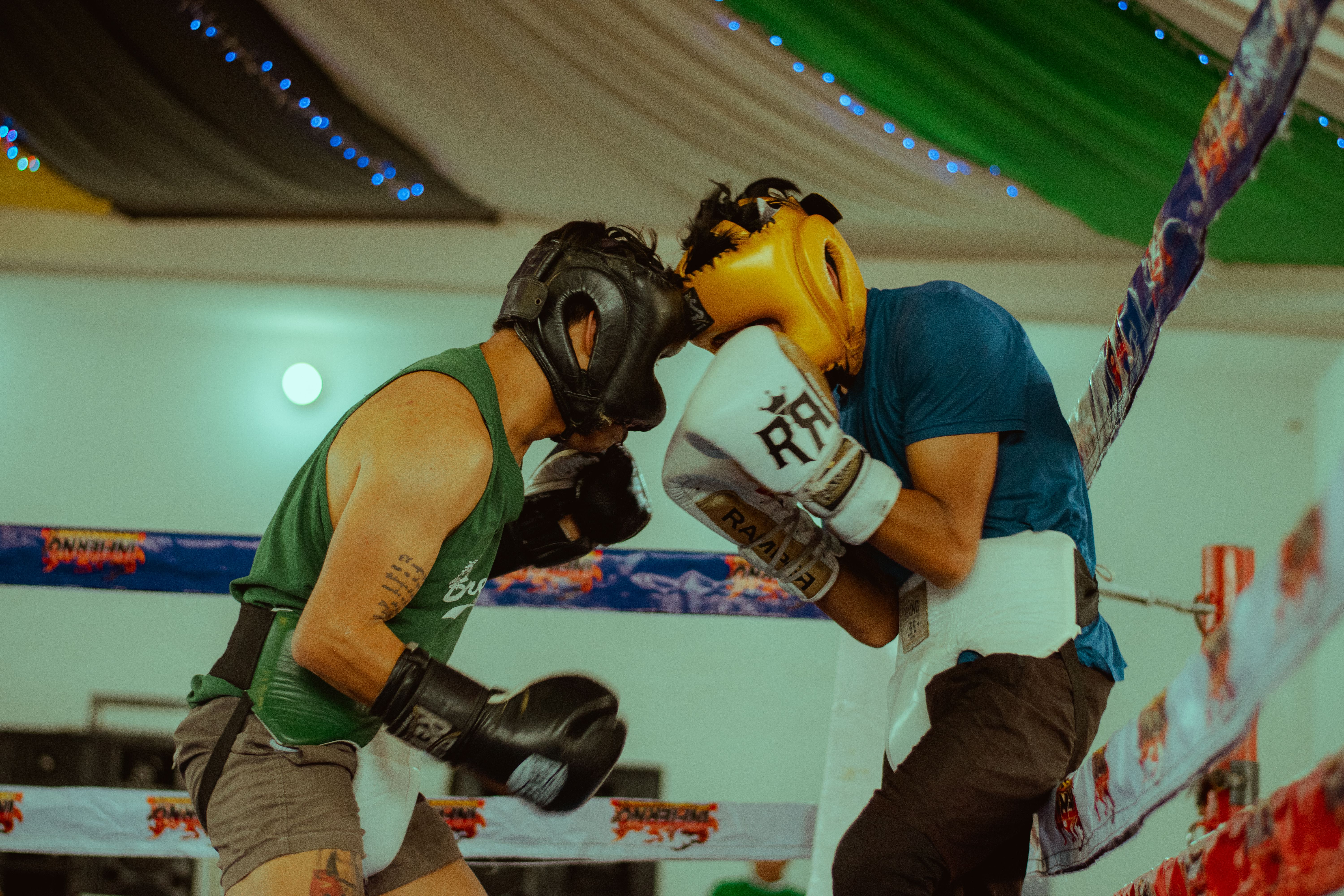 Boxing and MMA athletes sparring during combat training