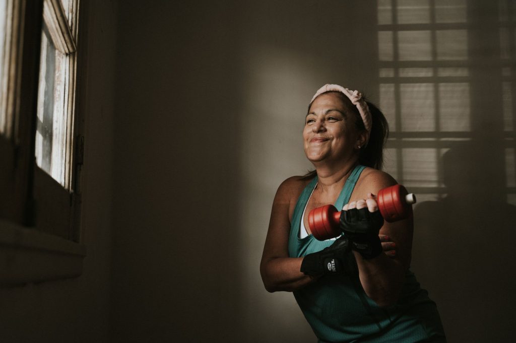 Menopause Strength Gym – middle aged woman lifting weights