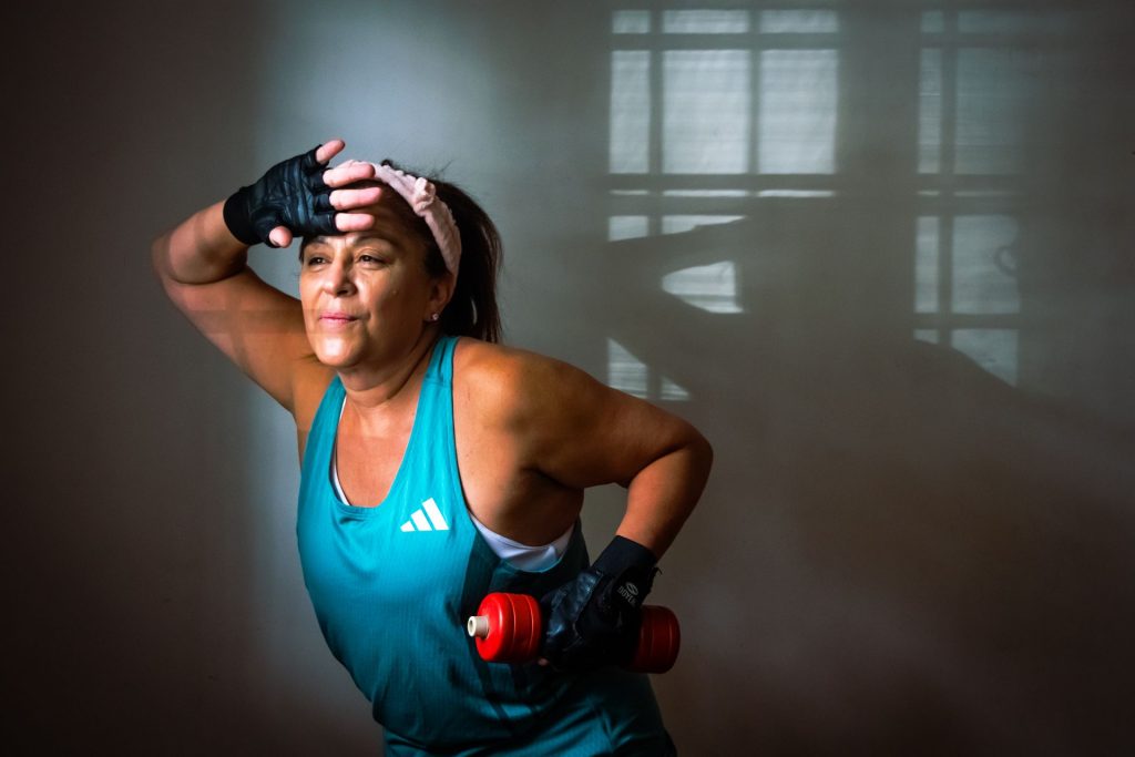 Menopause Strength Gym – middle aged woman lifting weights