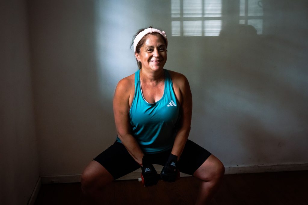 Menopause Strength Gym – middle aged woman lifting weights