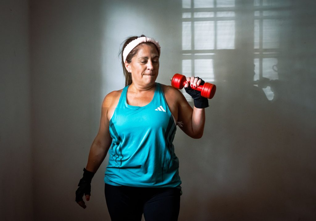 Menopause Strength Gym – middle aged woman lifting weights